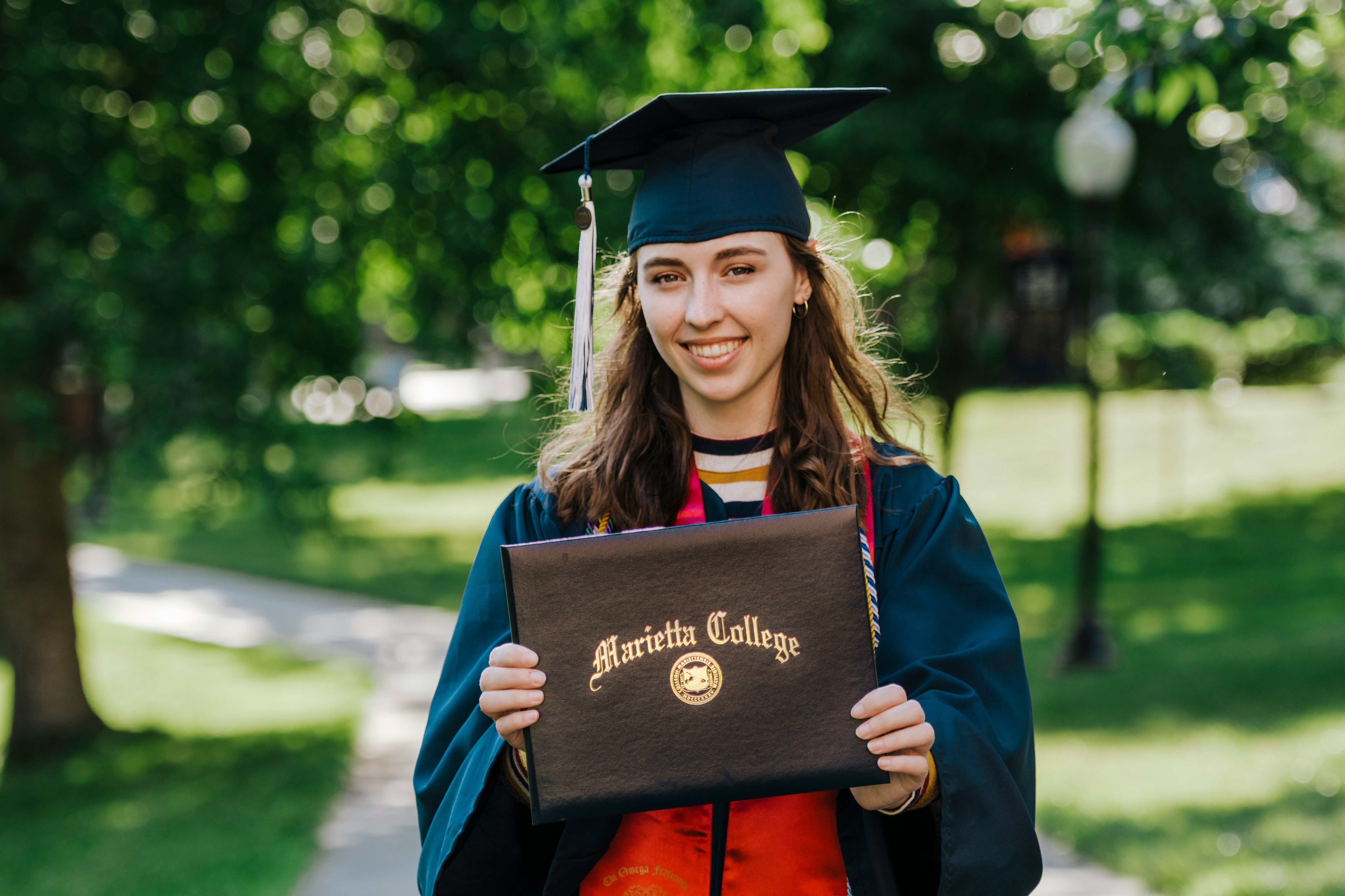 woman in academic dress wearing academic hat